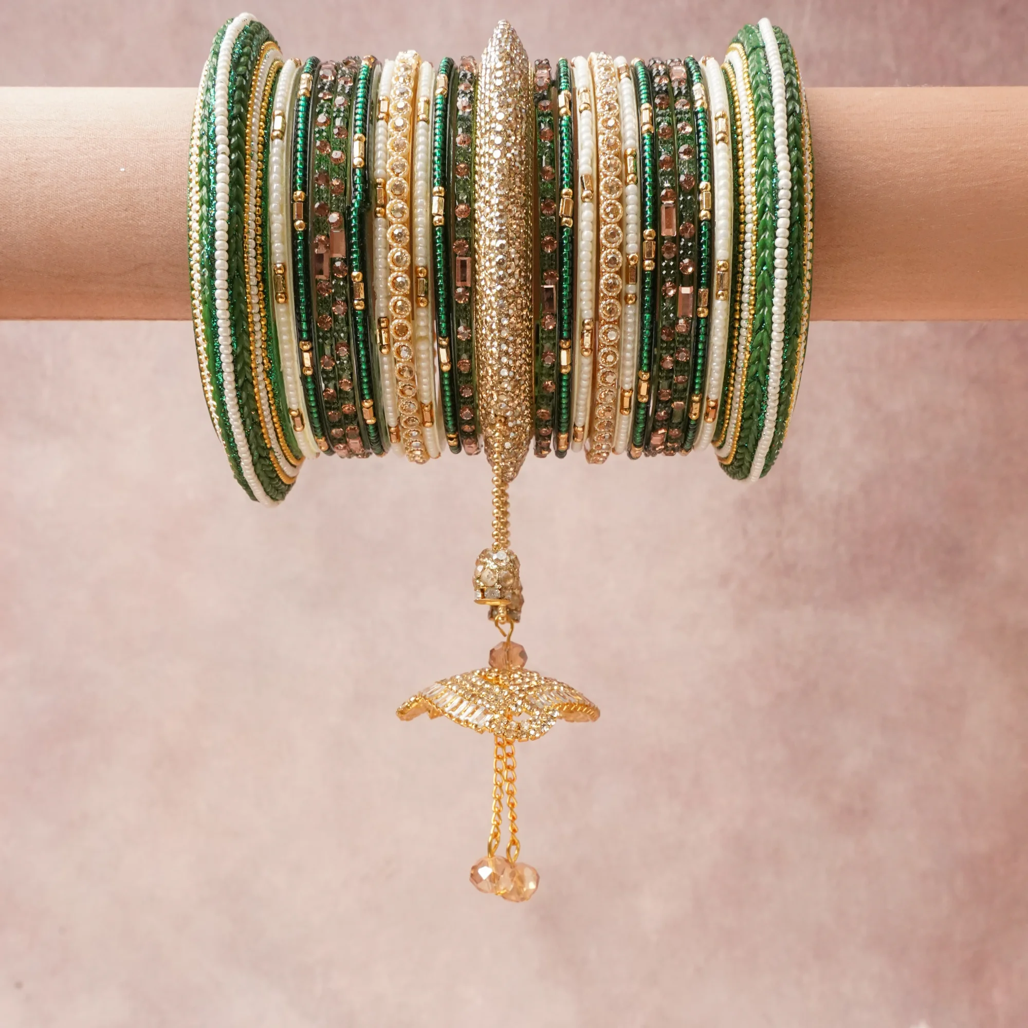 A commanding Emerald Green anchors this beautiful set, enriched with accents of Clear, Rose Quartz Pink, Chartreuse Green that add depth and dimension.

Featuring a striking composition of Gold-Toned Metal Alloy, Glass, Acrylic, Silk Thread, Cubic Zirconia, Simulated Pearl, Glass Seed Beads, Faceted Crystal, this set carries intricate craftsmanship and strong presence. Grand in form, it is created for moments that deserve to be marked.